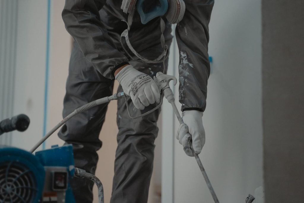 Wall cavity insulation being installed during home construction