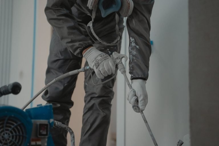 Wall cavity insulation being installed during home construction